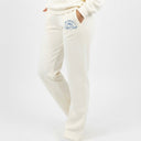 Woman wearing a white Bluebird Ski tracksuit with text on a white background